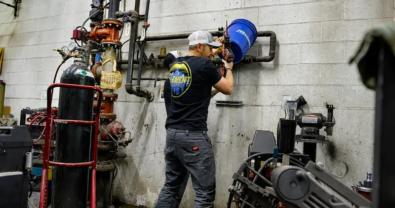 Element plumber mounting a water treatment system in St. George, UT