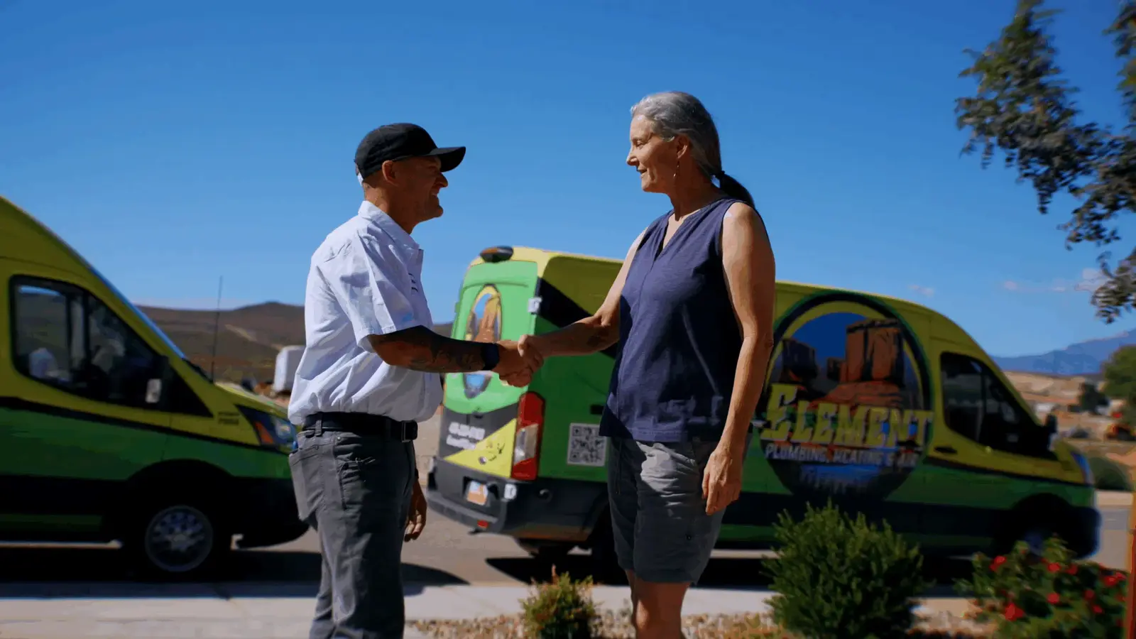 Element Plumbing Heating Air technician shaking hands with a customer in St. George UT