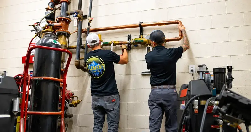 Element technicians installing a whole-home filtration system in St. George, UT
