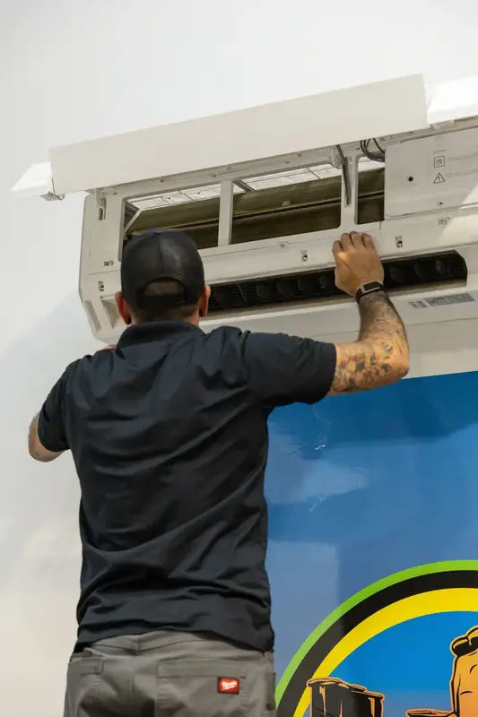 Element technician cleaning a mini split indoor unit in St. George, UT