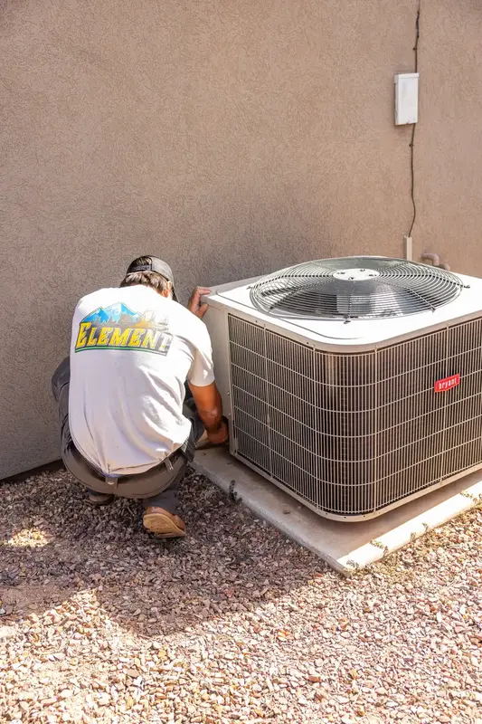 Element technician servicing an AC condenser in St. George, UT