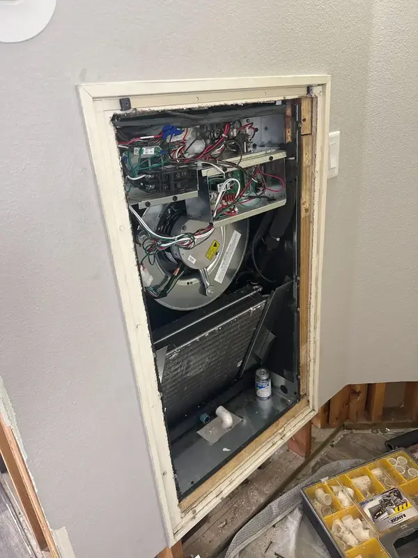 Open furnace cabinet during a tune-up in St. George, UT