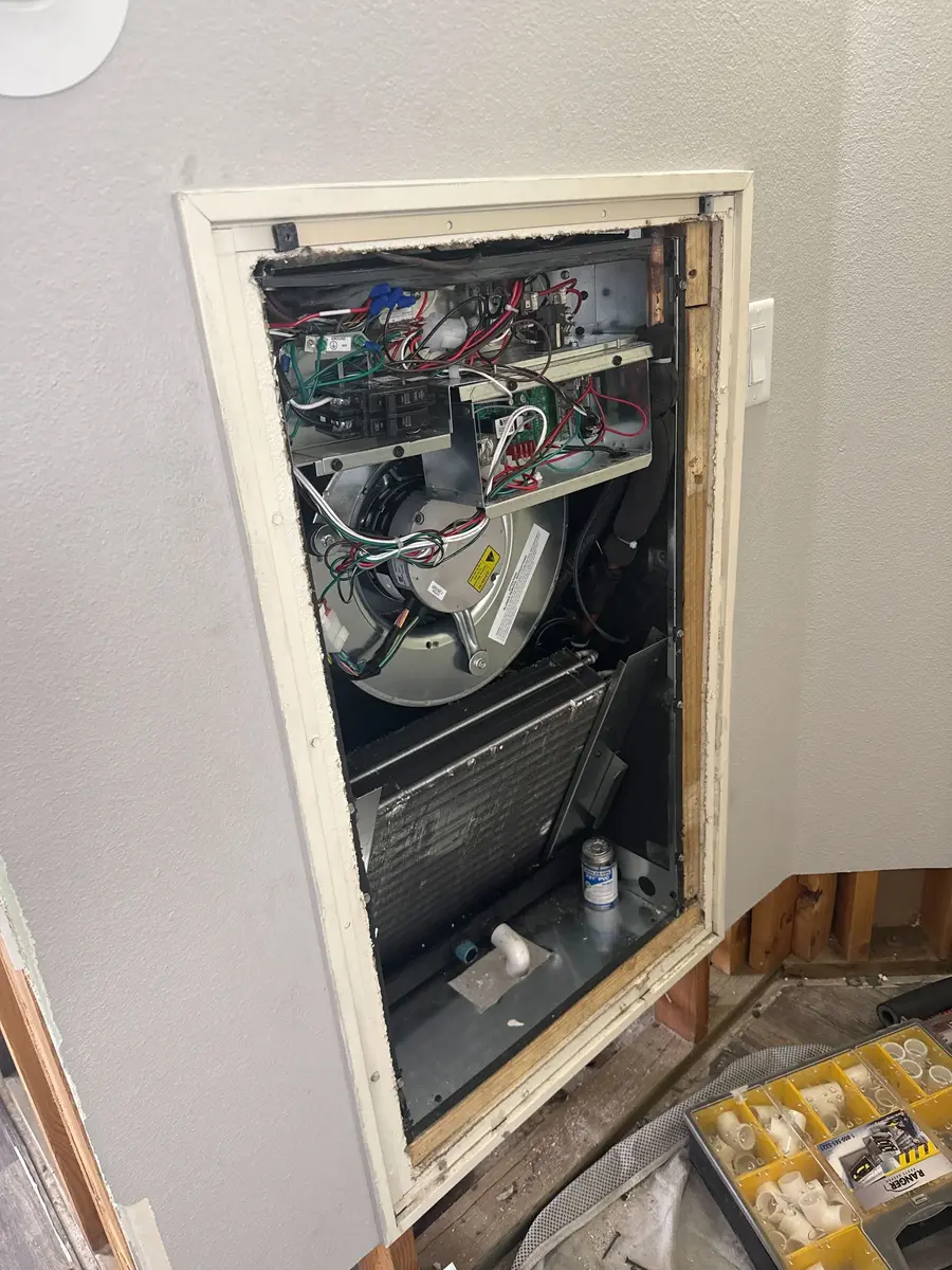 Open furnace cabinet during a tune-up in St. George, UT