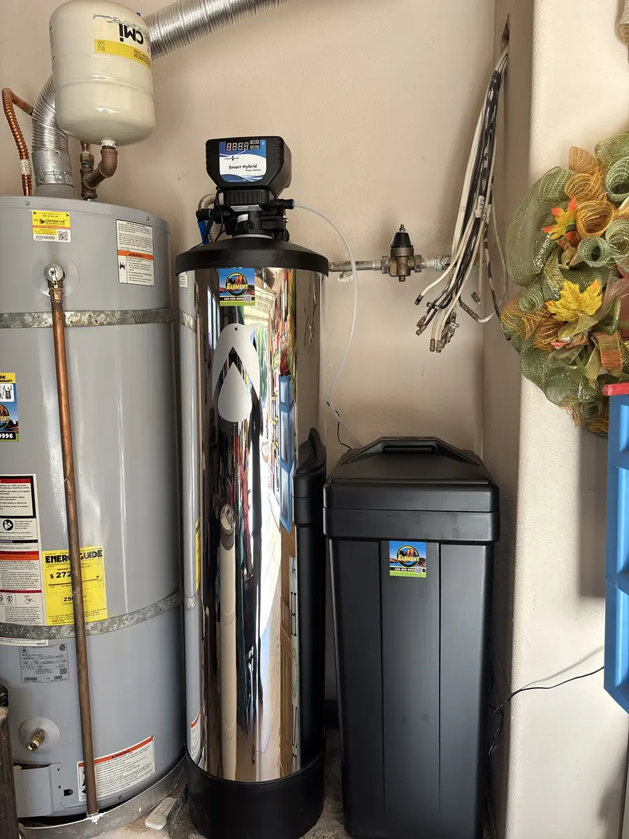 Water softener and brine tank beside a water heater in St. George, UT